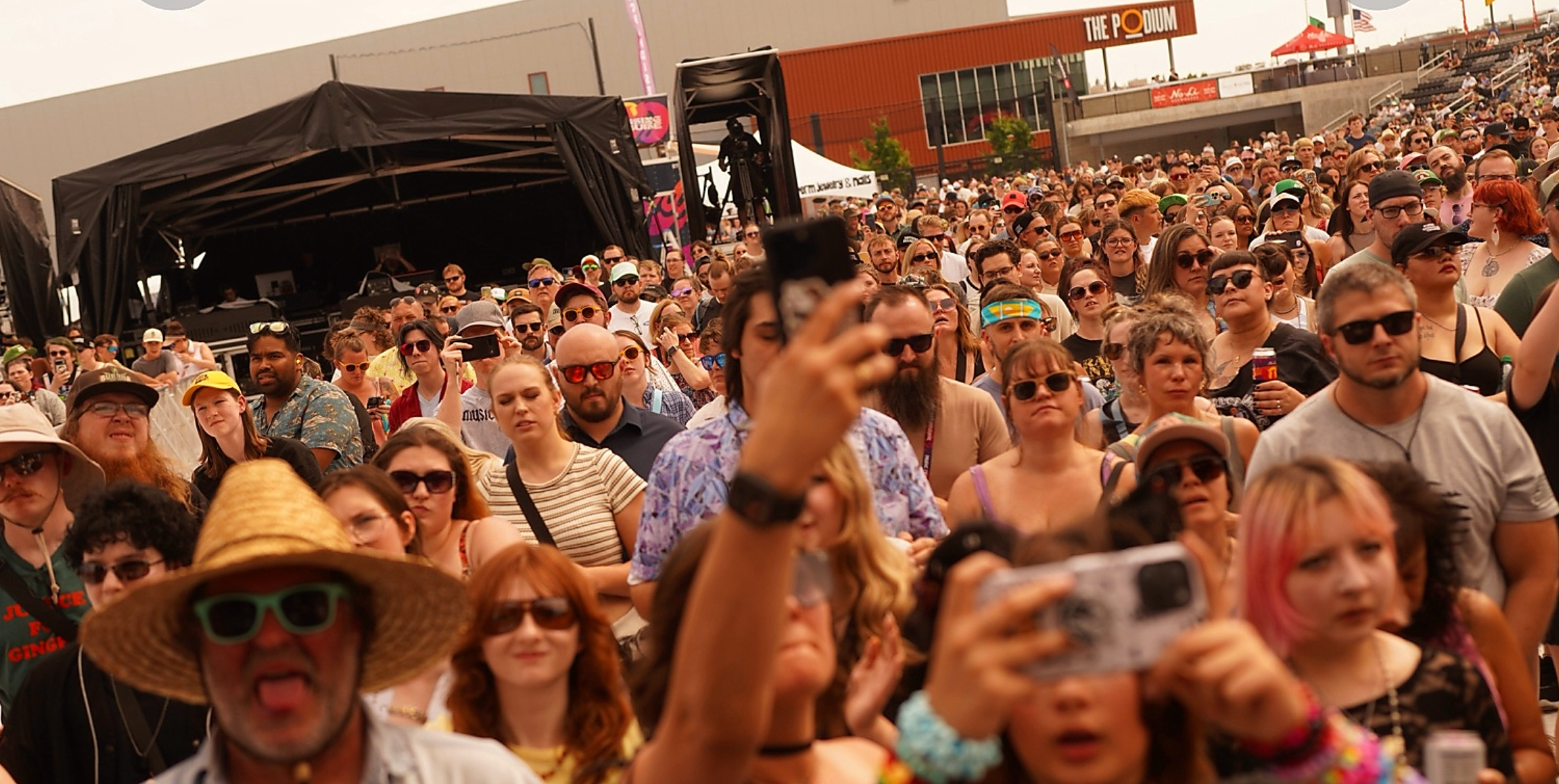 Festival crowd facing the stage at Blessing in Disguise Music Festival at ONE Spokane Stadium