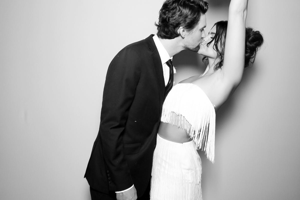 Wedding guests using an Electric Photoland staffed photo booth