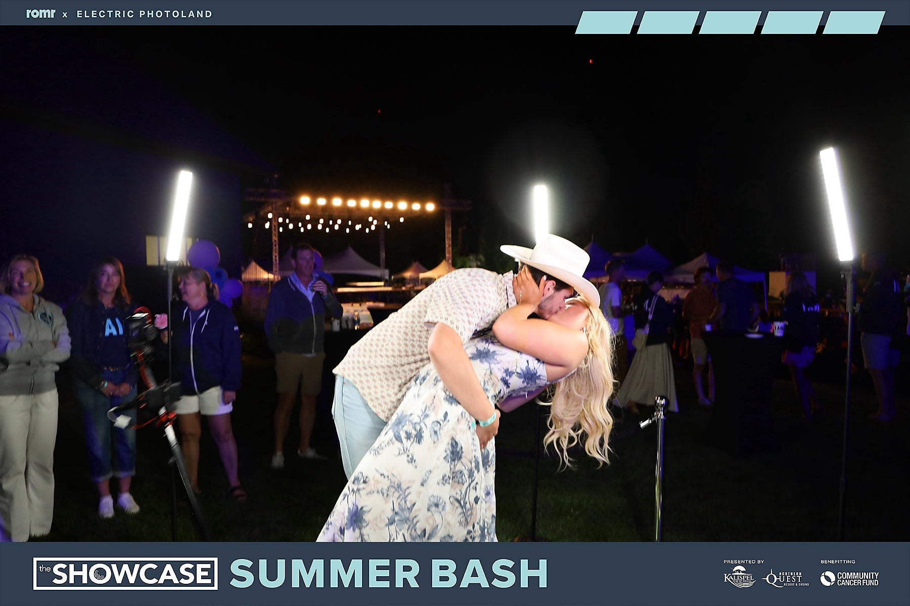 A couple sharing an unscripted moment photographed by Electric Photoland at The Showcase Summer Bash